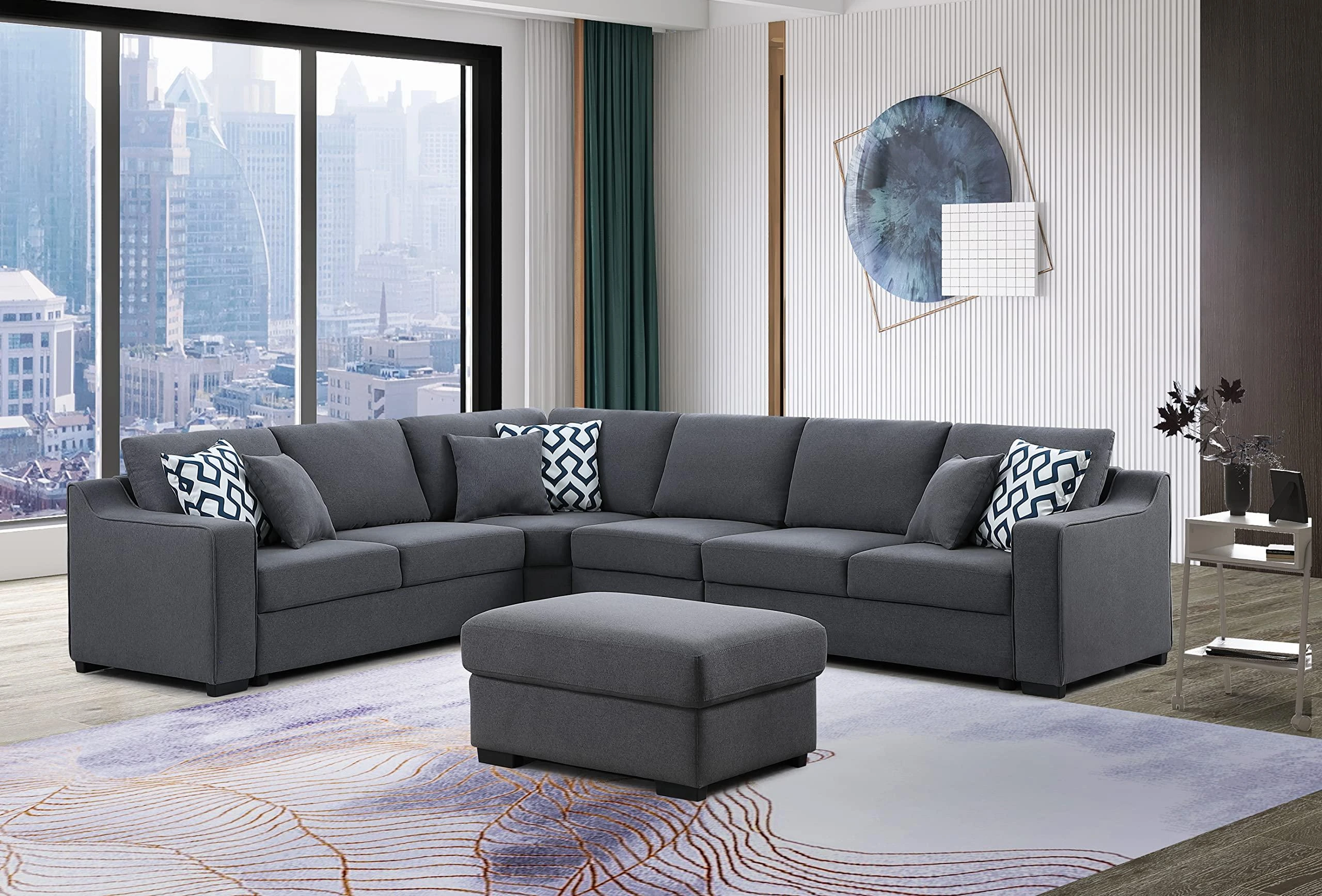 Grey sectional sofa with an ottoman in a bright living room, the kind of big purchase worth checking before a sale