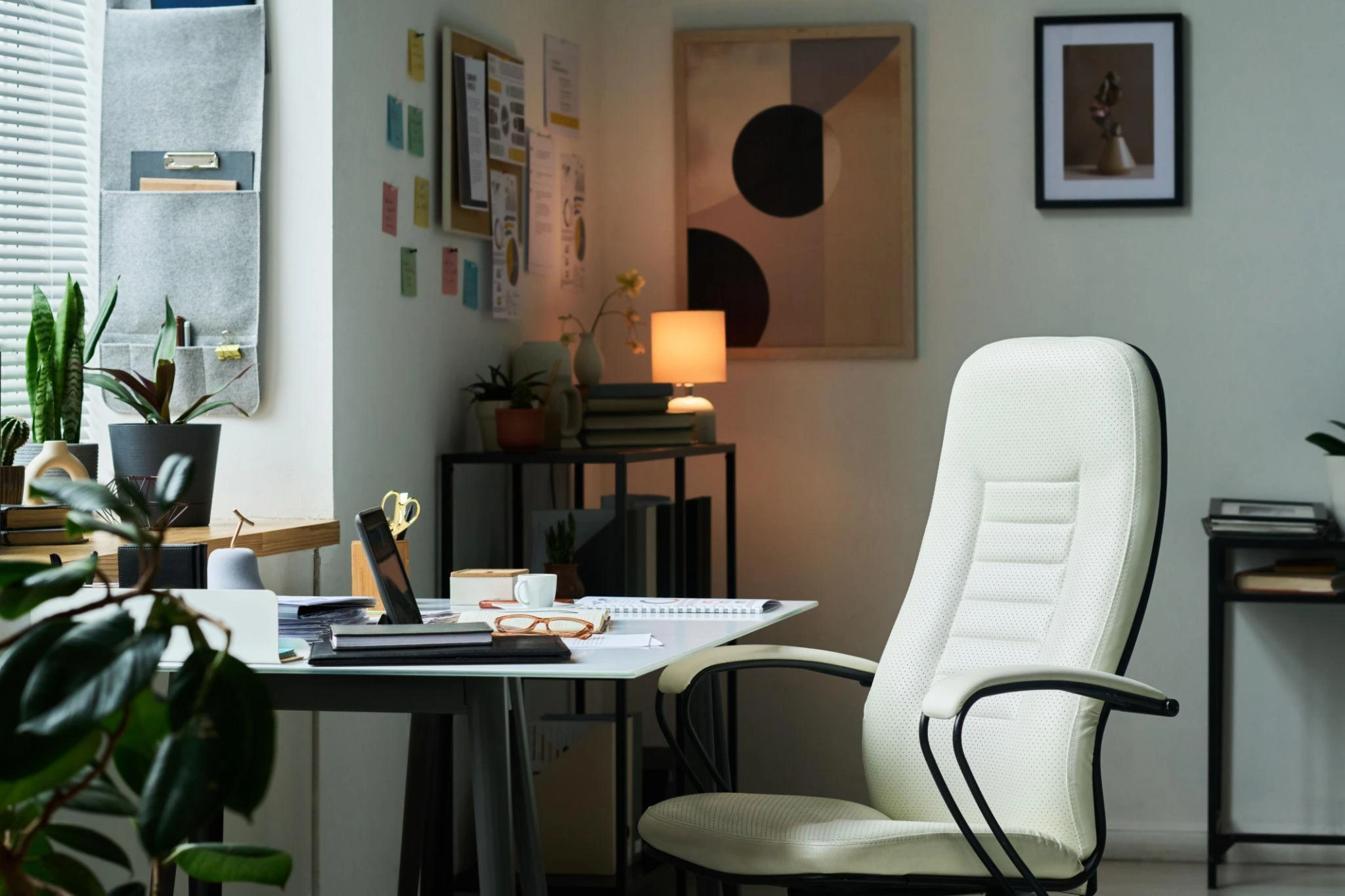 Home office with a white ergonomic office chair and desk