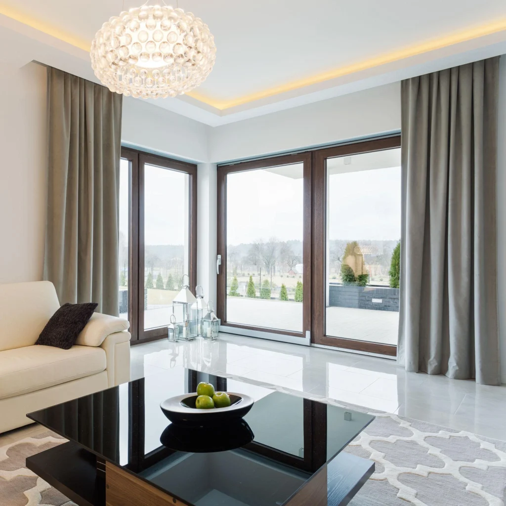Cream sofa in a bright modern small living room with cozy minimalist decor