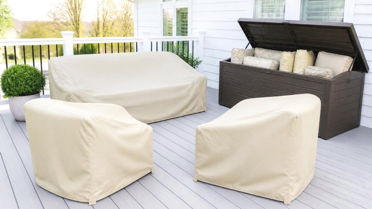 Patio furniture under waterproof covers with cushions stored in a deck box for winter