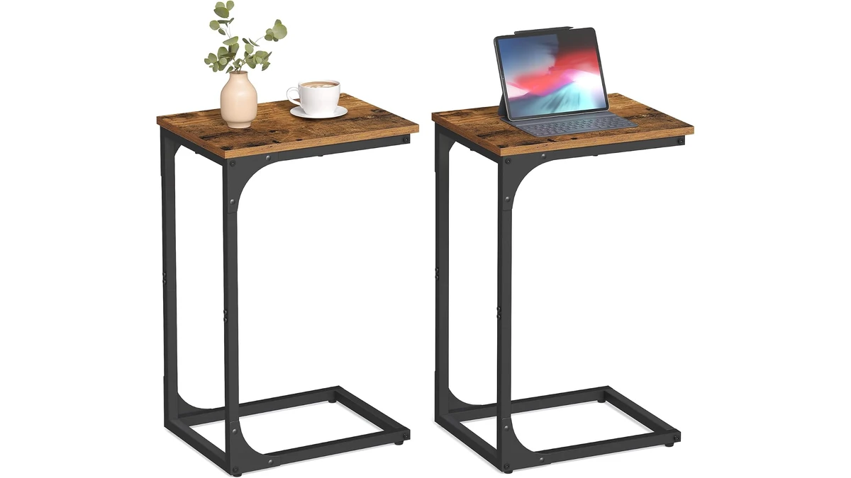 Two VASAGLE C-shaped end tables with rustic brown tops and black metal frames, holding a tablet and a coffee cup